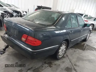 1997 Mercedes-Benz E-Class with VIN WDBJF55F8VA415421, listed as a IAAI auction lot 41536015 with 237,345 mi miles. Bid and sale history available at carsss.com. Image 4.