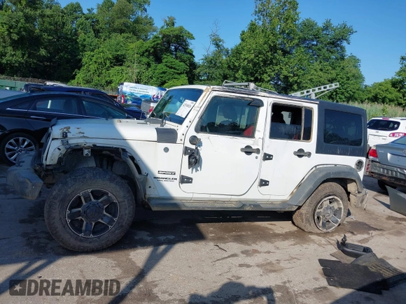 2016 Jeep Wrangler Unlimited Sport z VIN 1C4BJWDG5GL257423, wystawiony jako IAAI lot #42530026 z przebiegiem 157 072 mil mil oraz . Historia ofert i sprzedaży dostępna na DreamBid. Obrazek 14.