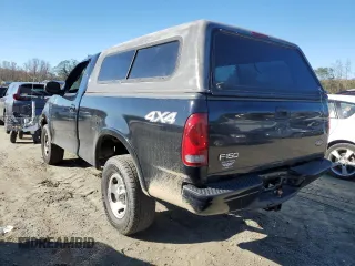 2002 Ford F-150 XL with VIN 1FTRF18232NA58109, listed as a Copart auction lot 79080674 with 148,213 mi miles and Salvage title. Bid and sale history available at DreamBid. Image 2.