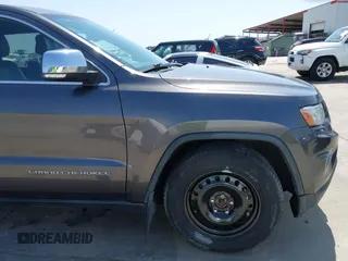 2014 Jeep Grand Cherokee Limited z VIN 1C4RJFBT0EC241030, wystawiony jako IAAI lot #41851316 z przebiegiem 104 344 mil mil oraz . Historia ofert i sprzedaży dostępna na DreamBid. Obrazek 18.
