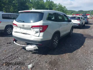 2021 Honda Pilot EX with VIN 5FNYF6H38MB072297, listed as a IAAI auction lot 42561276 with 119,172 mi miles and . Bid and sale history available at DreamBid. Image 4.