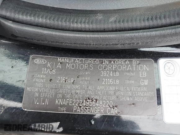 2009 Kia Spectra EX with VIN KNAFE222495648220, listed as a Copart auction lot 52886915 with 146,417 mi miles and Salvage title. Bid and sale history available at DreamBid. Image 14.