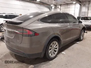 2016 Tesla Model X 70D with VIN 5YJXCBE27GF004974, listed as a IAAI auction lot 41630556 with 167,709 mi miles. Bid and sale history available at carsss.com. Image 4.