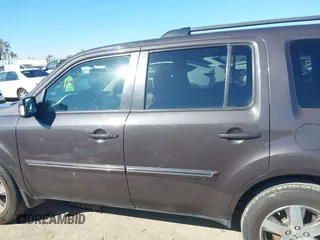 2015 Honda Pilot Touring with VIN 5FNYF3H94FB002236, listed as a IAAI auction lot 41735221 with 112,766 mi miles. Bid and sale history available at carsss.com. Image 14.