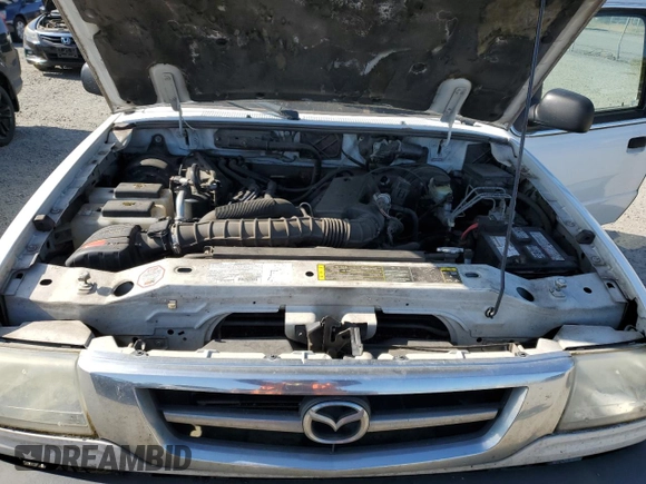 2003 Mazda B-Series Truck z VIN 4F4YR46U93TM21400, wystawiony jako Copart lot #56239985 z przebiegiem 133 893 mil mil oraz Szkoda całkowita • Salvage title. Historia ofert i sprzedaży dostępna na DreamBid. Obrazek 11.