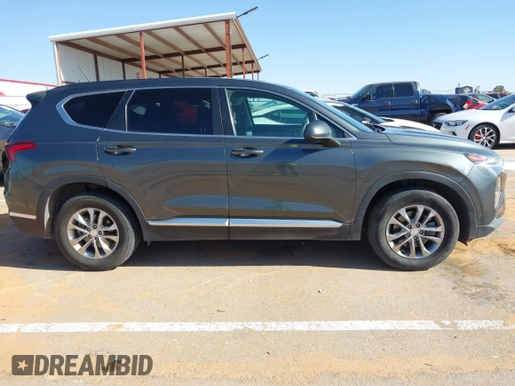 2019 Hyundai Santa Fe SE with VIN 5NMS23AD2KH134016, listed as a IAAI auction lot 41977240 with 61,448 mi miles and . Bid and sale history available at DreamBid. Image 13.