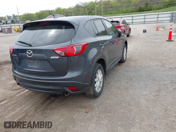 2014 Mazda CX-5 Touring with VIN JM3KE2CYXE0332517, listed as a IAAI auction lot 42109592 with 138,214 mi miles. Bid and sale history available at carsss.com. Image 4.