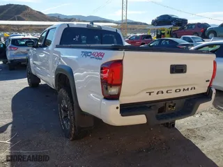 2019 Toyota Tacoma 4WD SR5 with VIN 3TMDZ5BN1KM079305, listed as a IAAI auction lot 41247804 with 98,494 mi miles. Bid and sale history available at carsss.com. Image 3.