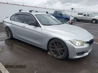 2014 BMW 3 Series 328i with VIN WBA3C1C58EK105766, listed as a IAAI auction lot 41692037 with 156,038 mi miles. Bid and sale history available at carsss.com. Image 1.
