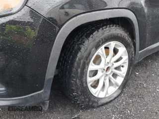 2019 Jeep Cherokee Latitude with VIN 1C4PJLCBXKD357403, listed as a IAAI auction lot 41606497 with 104,102 mi miles and . Bid and sale history available at carsss.com. Image 6.
