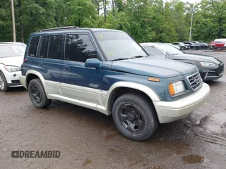 1997 Suzuki Sidekick z VIN JS3TD21V7V4109189, wystawiony jako IAAI lot #42526480 z przebiegiem 133 248 mil mil oraz . Historia ofert i sprzedaży dostępna na DreamBid. Obrazek 1.