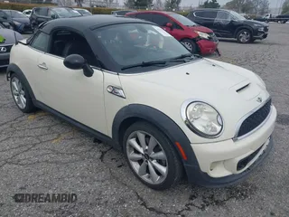 2013 MINI Coupe S with VIN WMWSX3C53DT466648, listed as a IAAI auction lot 41719597 with 106,936 mi miles and . Bid and sale history available at DreamBid. Image 1.