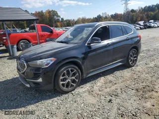 2020 BMW X1 sDrive28i with VIN WBXJG7C09L5P99565, listed as a Copart auction lot 77666104 with 53,774 mi miles and Salvage Title. Bid and sale history available at carsss.com. Image 1.