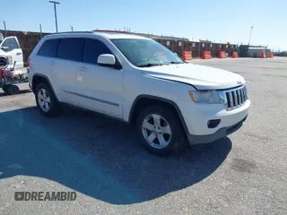 2011 Jeep Grand Cherokee Laredo z VIN 1J4RR4GG6BC737755, wystawiony jako IAAI lot #41985496 z przebiegiem 185 507 mil mil oraz . Historia ofert i sprzedaży dostępna na DreamBid. Obrazek 1.