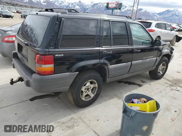 1996 Jeep Grand Cherokee with VIN 1J4EZ58S8TC106529, listed as a Copart auction lot 50163965 with 226,951 mi miles and Salvage title. Bid and sale history available at DreamBid. Image 3.