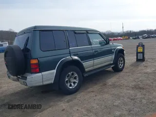 1995 Mitsubishi Montero z VIN JA4MR41H7SJ010597, wystawiony jako IAAI lot #41610885 z przebiegiem 162 406 mil mil oraz . Historia ofert i sprzedaży dostępna na DreamBid. Obrazek 4.