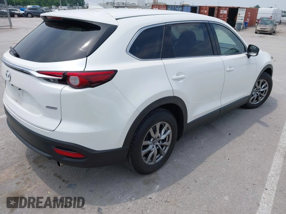 2019 Mazda CX-9 Touring with VIN JM3TCACY1K0334804, listed as a IAAI auction lot 42411662 with 49,447 mi miles and . Bid and sale history available at DreamBid. Image 4.