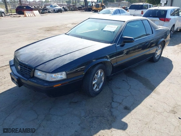 2001 Cadillac Eldorado Touring ETC with VIN 1G6ET12911B103774, listed as a IAAI auction lot 41998828 with 128,724 mi miles. Bid and sale history available at carsss.com. Image 2.