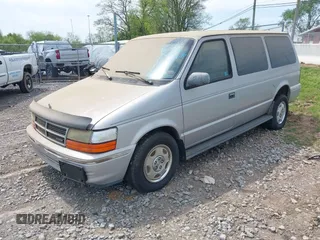 1991 Dodge Grand Caravan with VIN 1B4GK54R6MX632977, listed as a IAAI auction lot 42063934 with 130,812 mi miles and . Bid and sale history available at DreamBid. Image 2.