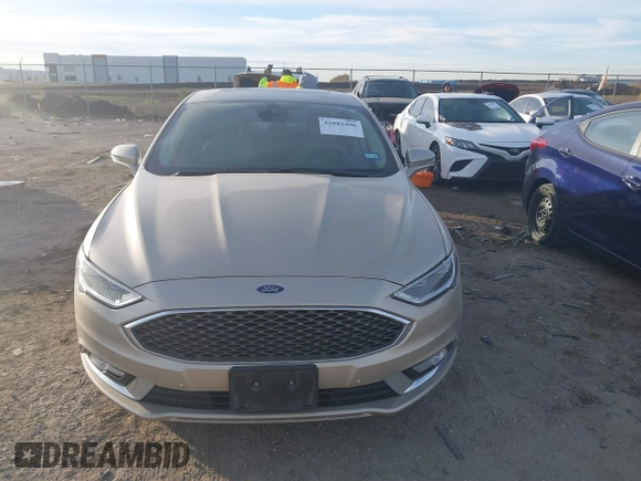 2017 Ford Fusion Titanium z VIN 3FA6P0SU5HR373140, wystawiony jako IAAI lot #41082406 z przebiegiem 98 422 mil mil oraz . Historia ofert i sprzedaży dostępna na DreamBid. Obrazek 12.