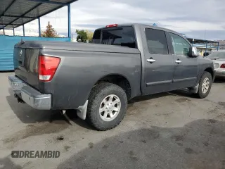 2005 Nissan Titan SE with VIN 1N6AA07B65N566082, listed as a Copart auction lot 80879174 with 215,297 mi miles and Clean Title. Bid and sale history available at carsss.com. Image 3.