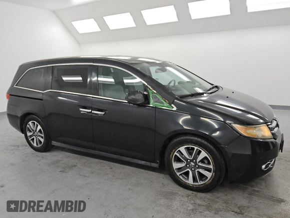 2015 Honda Odyssey Touring Elite with VIN 5FNRL5H95FB017434, listed as a Copart auction lot 55011035 with 111,254 mi miles and Clean title. Bid and sale history available at DreamBid. Image 4.