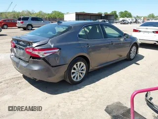 2019 Toyota Camry LE with VIN 4T1B11HK8KU289721, listed as a IAAI auction lot 42021107 with 69,828 mi miles and . Bid and sale history available at DreamBid. Image 4.