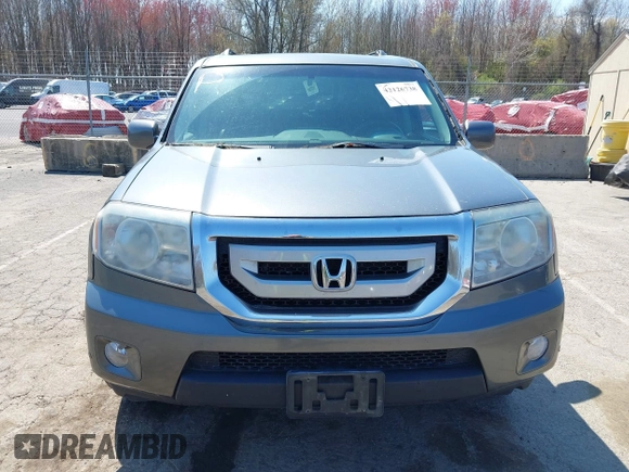 2011 Honda Pilot Touring with VIN 5FNYF4H94BB035415, listed as a IAAI auction lot 42126738 with 239,273 mi miles. Bid and sale history available at carsss.com. Image 12.