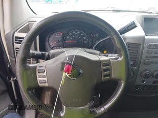 2005 Nissan Titan LE z VIN 1N6AA07B05N557667, wystawiony jako IAAI lot #42292562 z przebiegiem 197 874 mil mil oraz . Historia ofert i sprzedaży dostępna na DreamBid. Obrazek 11.