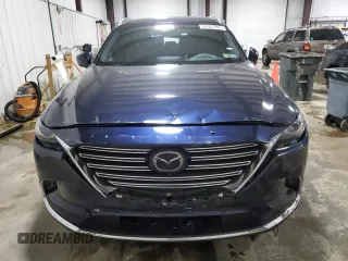 2023 Mazda CX-9 Grand Touring with VIN JM3TCBDY1P0630868, listed as a Copart auction lot 56321205 with 50,427 mi miles and Salvage title. Bid and sale history available at DreamBid. Image 5.