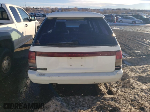 1994 Subaru Legacy L with VIN 4S3BJ6335R9948773, listed as a Copart auction lot 77018384 with 189,202 mi miles and Clean title. Bid and sale history available at DreamBid. Image 6.