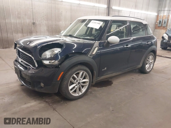 2014 MINI Countryman S with VIN WMWZC5C56EWP38017, listed as a IAAI auction lot 42287308 with 151,780 mi miles and . Bid and sale history available at DreamBid. Image 2.