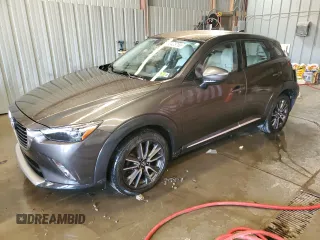 2016 Mazda CX-3 Grand Touring z VIN JM1DKFD74G0137815, wystawiony jako Copart lot #52405765 z przebiegiem 128 922 mil mil oraz Szkody całkowita. Historia ofert i sprzedaży dostępna na DreamBid. Obrazek 1.