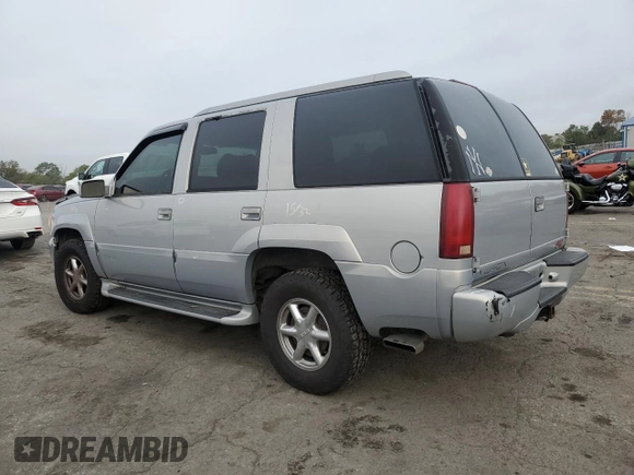 2000 GMC Denali z VIN 1GKEK13RXYR110436, wystawiony jako Copart lot #74311244 z przebiegiem 250 735 mil mil oraz Szkody całkowita. Historia ofert i sprzedaży dostępna na DreamBid. Obrazek 2.