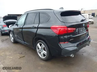 2021 BMW X1 xDrive28i with VIN WBXJG9C01M3M71033, listed as a IAAI auction lot 41723970 with 71,000 mi miles. Bid and sale history available at carsss.com. Image 3.