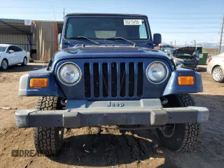 2003 Jeep Wrangler X z VIN 1J4FA39S43P338732, wystawiony jako Copart lot #56315495 z przebiegiem 135 480 mil mil oraz Szkoda całkowita • Salvage title. Historia ofert i sprzedaży dostępna na DreamBid. Obrazek 5.