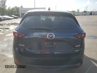 2018 Mazda CX-5 Grand Touring with VIN JM3KFADMXJ1353942, listed as a Copart auction lot 60570835 with 74,400 mi miles and Clean title. Bid and sale history available at DreamBid. Image 6.
