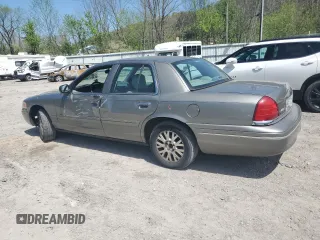 2004 Ford Crown Victoria LX z VIN 2FAFP74W14X130606, wystawiony jako Copart lot #54120085 z przebiegiem 221 700 mil mil oraz Szkody całkowita. Historia ofert i sprzedaży dostępna na DreamBid. Obrazek 2.