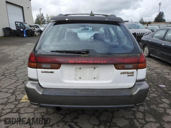 1996 Subaru Legacy Outback with VIN 4S3BG6850T7971454, listed as a Copart auction lot 52082395 with 173,542 mi miles and Salvage title. Bid and sale history available at DreamBid. Image 6.