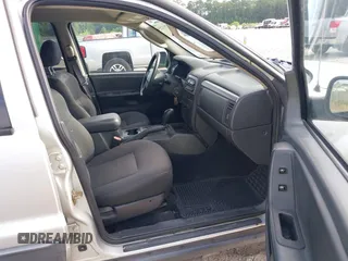 2004 Jeep Grand Cherokee Laredo z VIN 1J4GW48S94C372798, wystawiony jako IAAI lot #42812536 z przebiegiem 113 960 mil mil oraz . Historia ofert i sprzedaży dostępna na DreamBid. Obrazek 5.