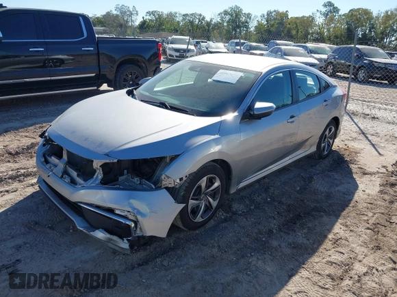 2020 Honda Civic LX with VIN 19XFC2F62LE009433, listed as a IAAI auction lot 40963670 with 117,865 mi miles and . Bid and sale history available at DreamBid. Image 2.