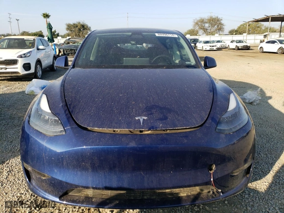 2023 Tesla Model Y Performance with VIN 7SAYGDEF5PF713543, listed as a Copart auction lot 80996714 with 33,311 mi miles and Salvage Title. Bid and sale history available at carsss.com. Image 5.