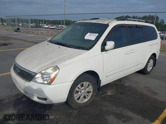 2012 Kia Sedona LX with VIN KNDMG4C7XC6446218, listed as a IAAI auction lot 42083645 with 151,844 mi miles. Bid and sale history available at carsss.com. Image 2.