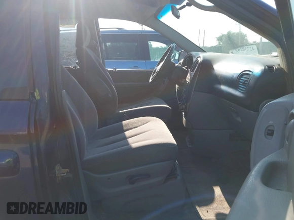 2005 Dodge Caravan SXT with VIN 2D4GP44L65R565519, listed as a IAAI auction lot 42730269 with 124,848 mi miles and . Bid and sale history available at DreamBid. Image 5.