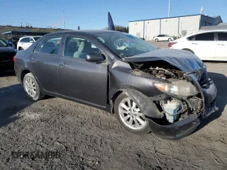 2010 Toyota Corolla with VIN 2T1BU4EE1AC363990, listed as a Copart auction lot 52001595 with 244,000 mi miles and Salvage title. Bid and sale history available at DreamBid. Image 4.