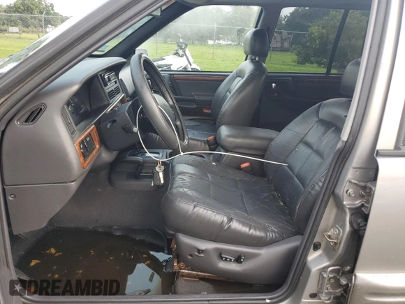 1998 Jeep Grand Cherokee Limited with VIN 1J4GZ78S2WC222768, listed as a Copart auction lot 73942154 with Not provided miles and Salvage title. Bid and sale history available at DreamBid. Image 7.
