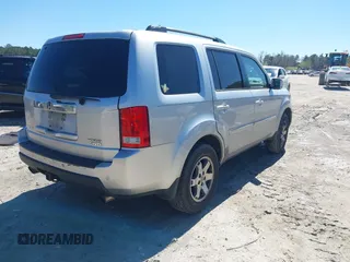 2011 Honda Pilot Touring with VIN 5FNYF4H91BB086712, listed as a IAAI auction lot 41809369 with 260,718 mi miles. Bid and sale history available at carsss.com. Image 4.