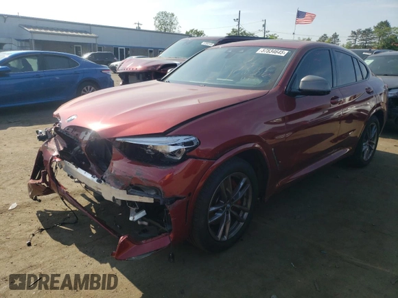 2021 BMW X4 M40i with VIN 5UX2V5C0XM9E78318, listed as a Copart auction lot 57834645 with 67,277 mi miles and Salvage title. Bid and sale history available at DreamBid. Image 1.