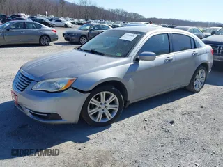 2013 Chrysler 200 Touring with VIN 1C3CCBBB4DN693621, listed as a IAAI auction lot 41738436 with 240,693 mi miles and . Bid and sale history available at DreamBid. Image 2.