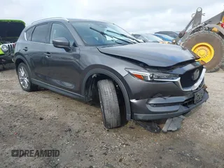 2020 Mazda CX-5 Grand Touring with VIN JM3KFBDM6L1867408, listed as a IAAI auction lot 42682528 with 41,631 mi miles and . Bid and sale history available at DreamBid. Image 1.